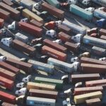 Trucks stand prepared to haul shipping containers at the Port of Los Angeles